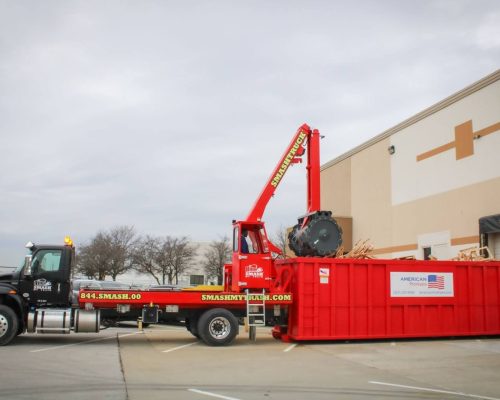 Smash My Trash® performing mobile waste compaction on an open-top dumpster