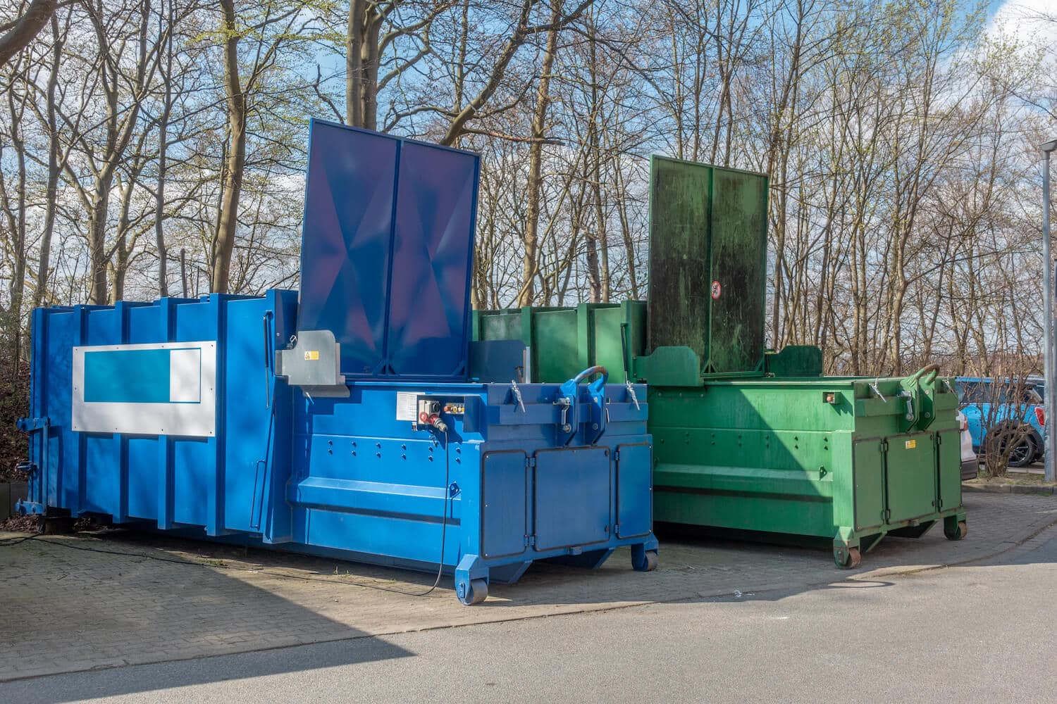 Two dumpster compactors